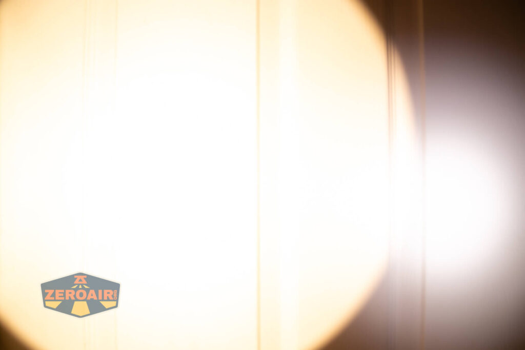 Skilhunt EC500 warm white flashlight beamshots on door (at 1') compared to nichia 219b 4500K