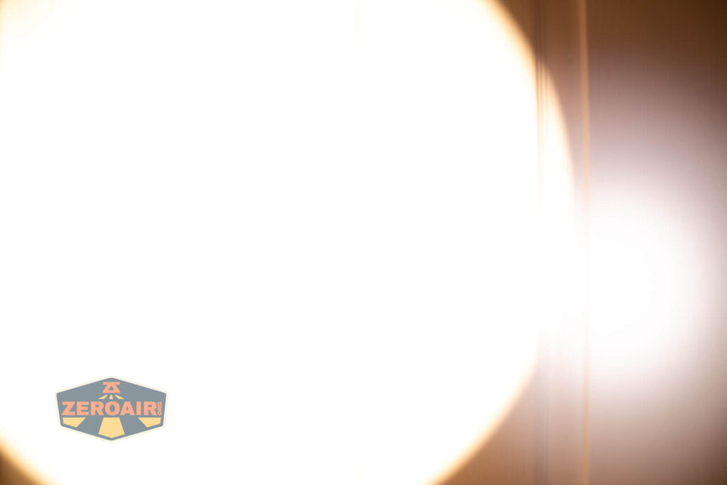 Skilhunt EC500 warm white flashlight beamshots on door (at 1') compared to nichia 219b 4500K