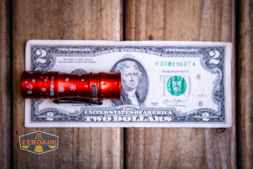 Wurkkos TS10 SG flashlight top down views on two dollar bill