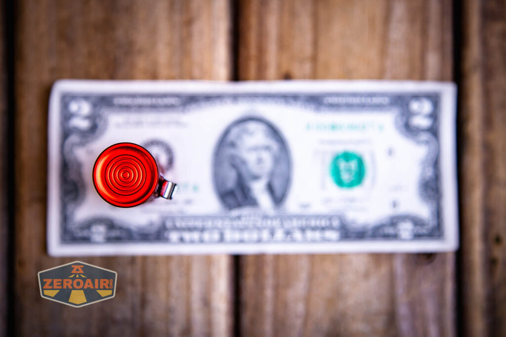 Wurkkos TS10 SG flashlight top down views on two dollar bill