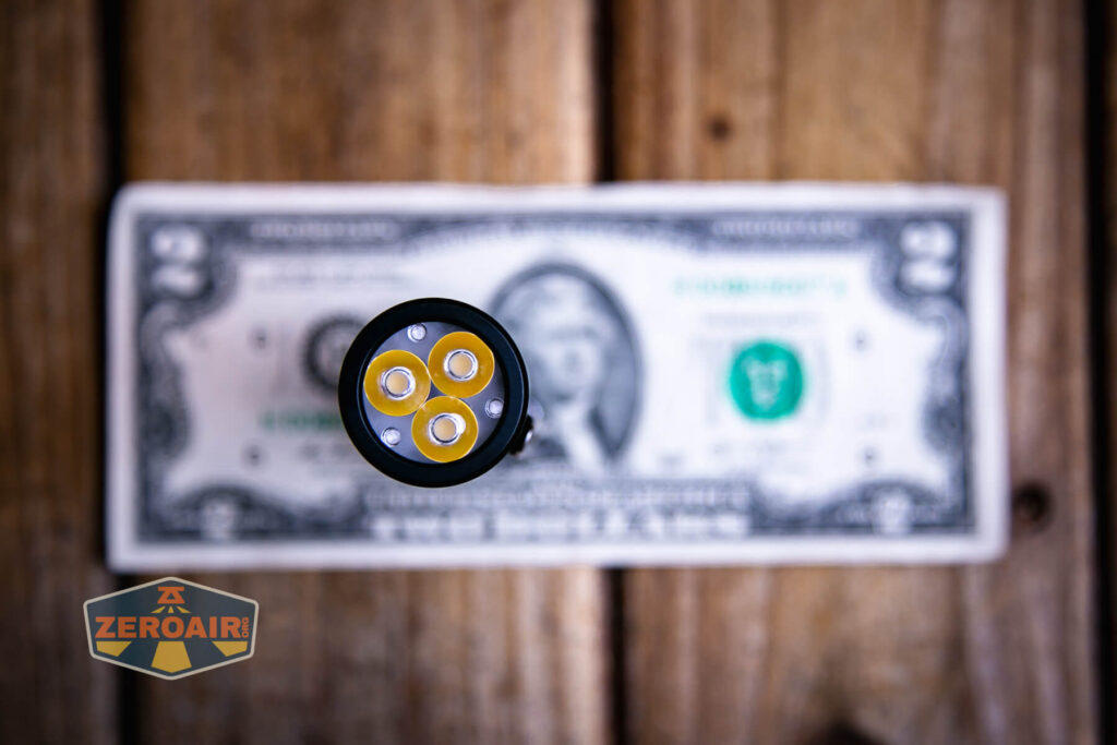 Wurkkos TS10 MAX flashlight on two dollar bill