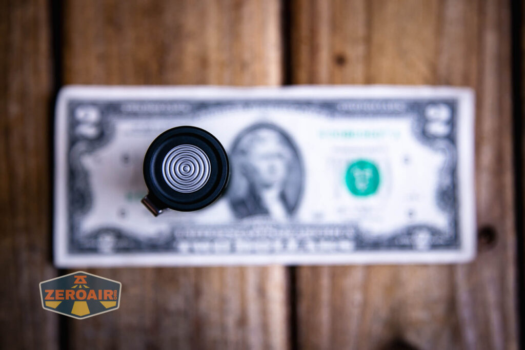 Wurkkos TS10 MAX flashlight on two dollar bill