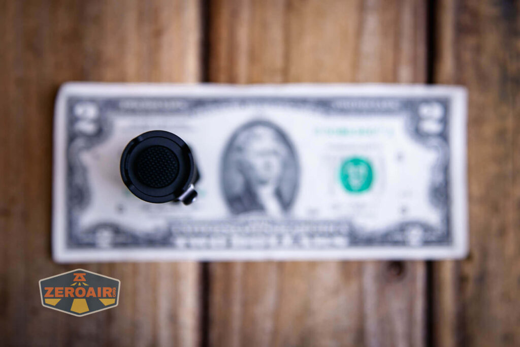 Maratac Mini LEP Cosmos flashlight on a two dollar bill