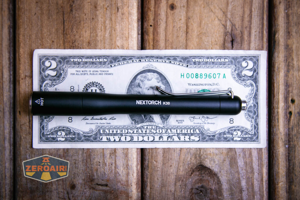 Nextorch K30 penlight on a two dollar bill
