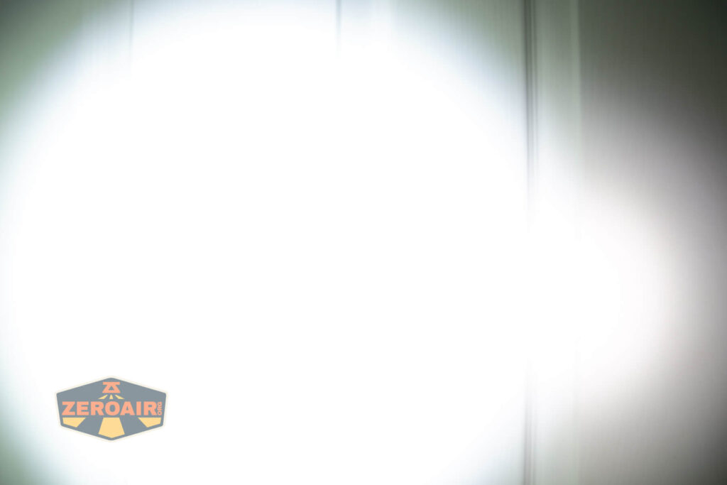 Nextorch K30 penlight beamshots on door (at 1') compared to nichia 219b 4500K