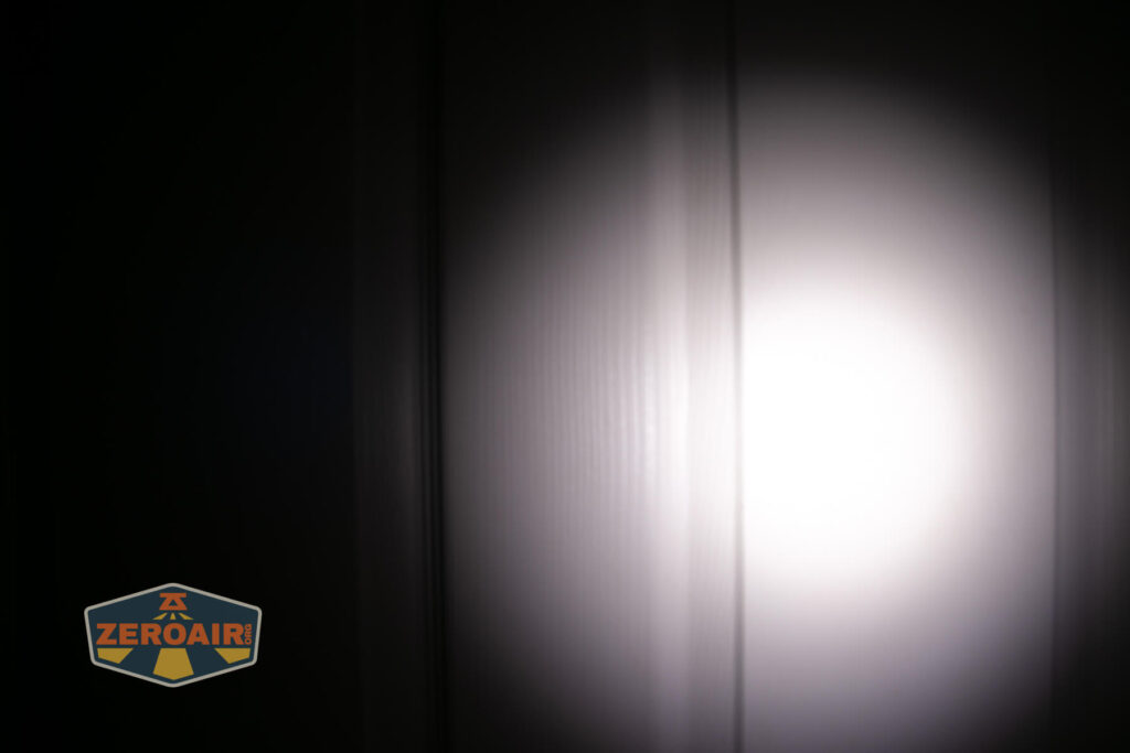Nextorch K33 UV penlight beamshots on door (at 1') compared to nichia 219b 4500K