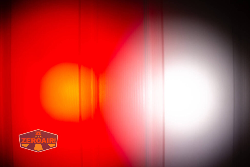 Nextorch TA21 portable tactical flashlight beamshots on door (at 1') compared to nichia 219b 4500K