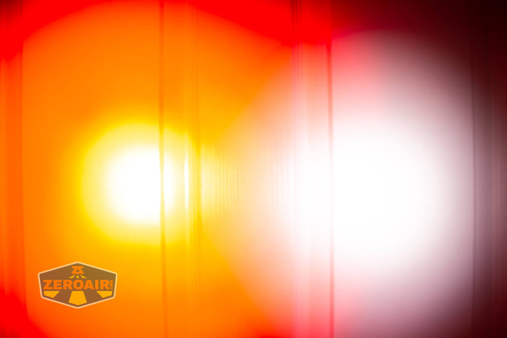 Nextorch TA21 portable tactical flashlight beamshots on door (at 1') compared to nichia 219b 4500K