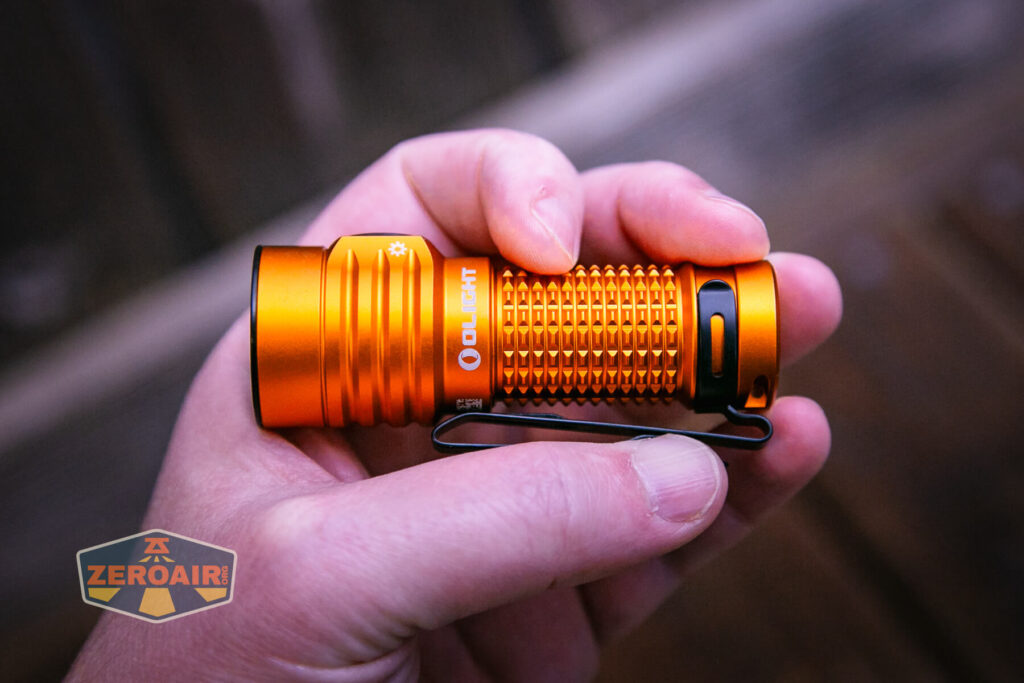 Olight Baton Turbo Orange flashlight in hand