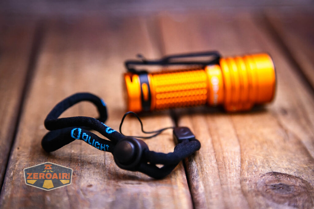 Olight Baton Turbo Orange flashlight with lanyard
