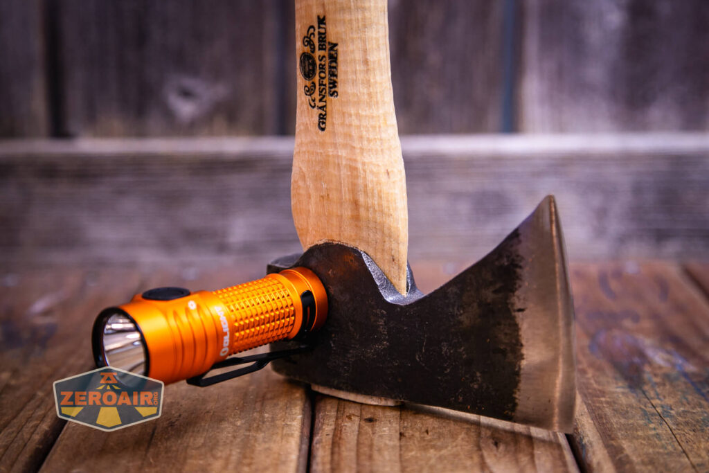 Olight Baton Turbo Orange flashlight tailcap magnet in use