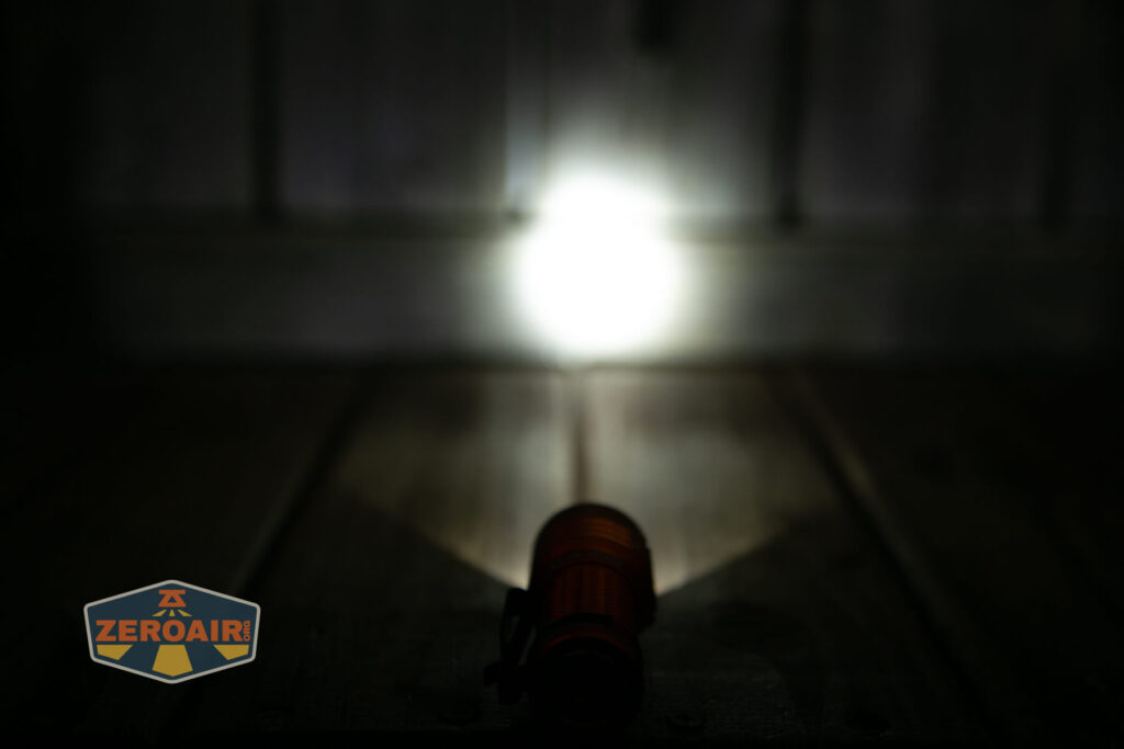 Olight Baton Turbo Orange flashlight emitter on