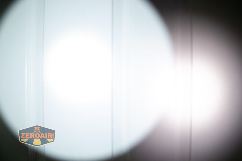 Olight Baton Turbo Orange flashlight beamshots on door compared to nichia 219b