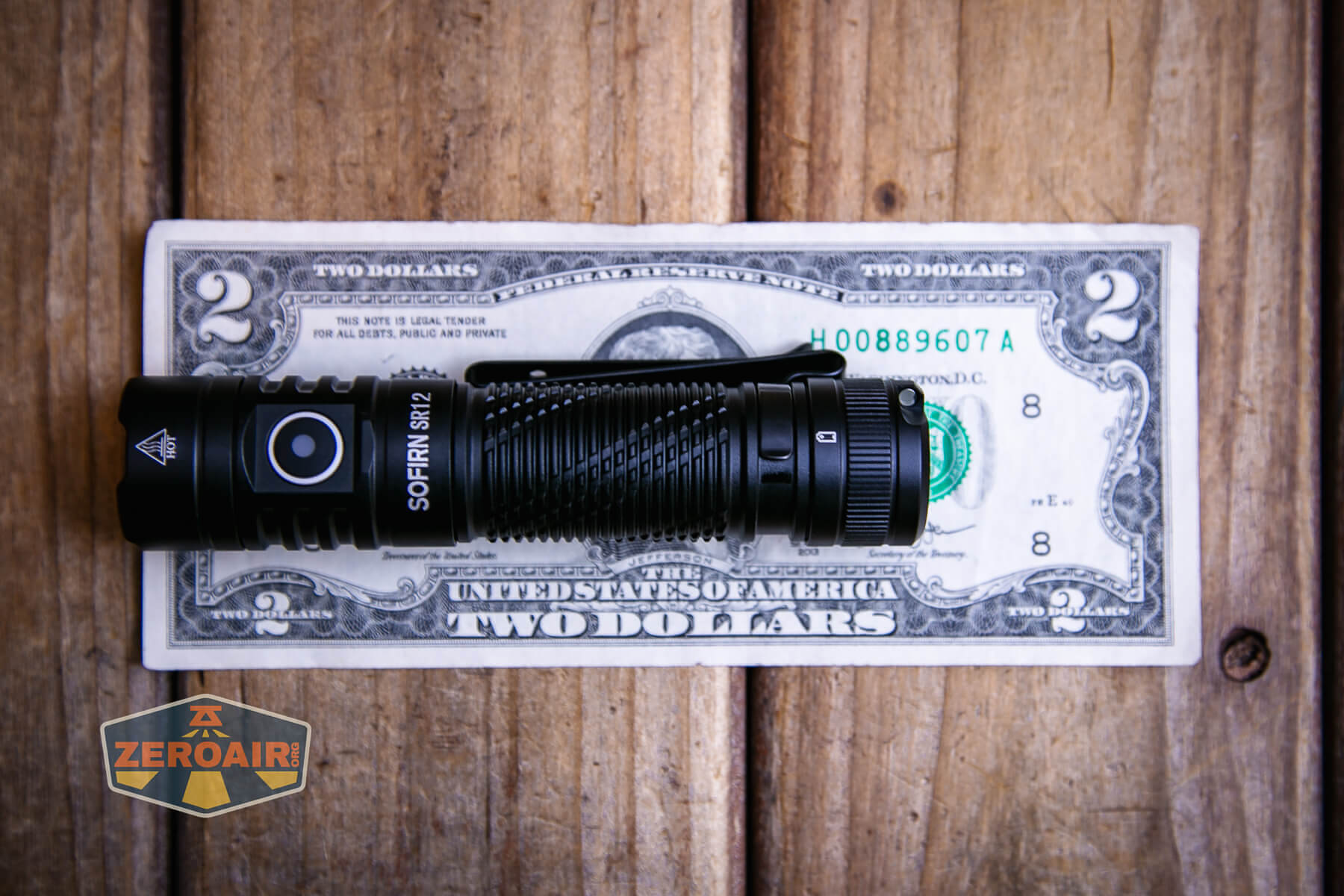 Sofirn SR12 pocket flashlight on a two dollar bill