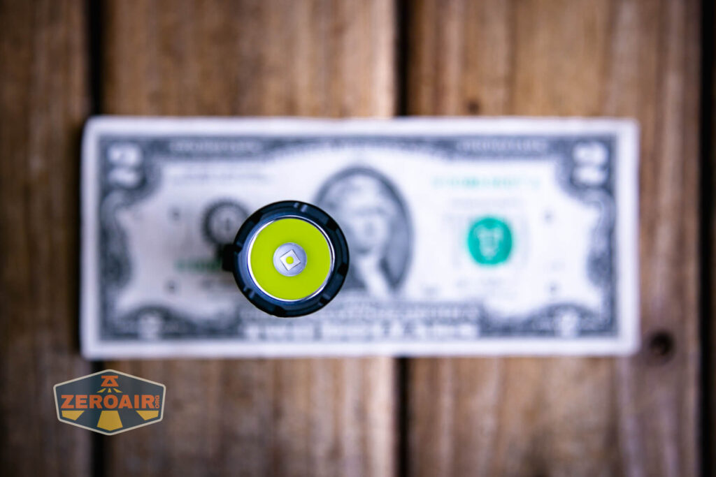 Sofirn SR12 pocket flashlight on a two dollar bill