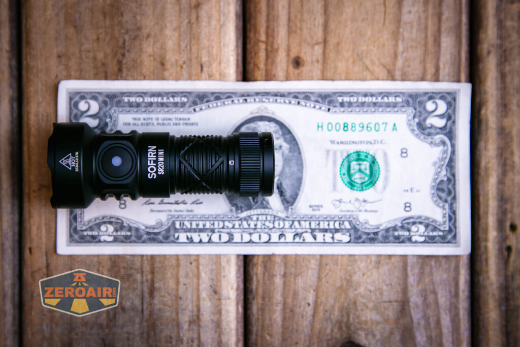Sofirn SR20 Mini EDC flashlight on a two dollar bill