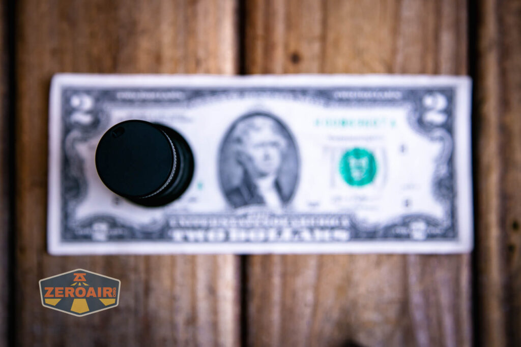 Sofirn SR20 Mini EDC flashlight on a two dollar bill