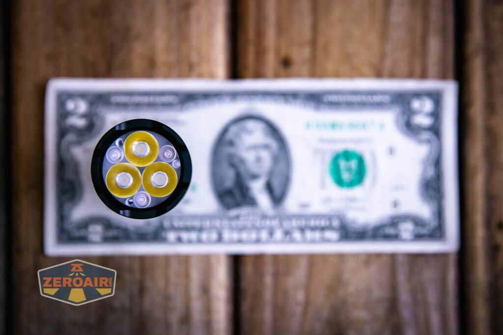 Sofirn SR20 Mini EDC flashlight on a two dollar bill