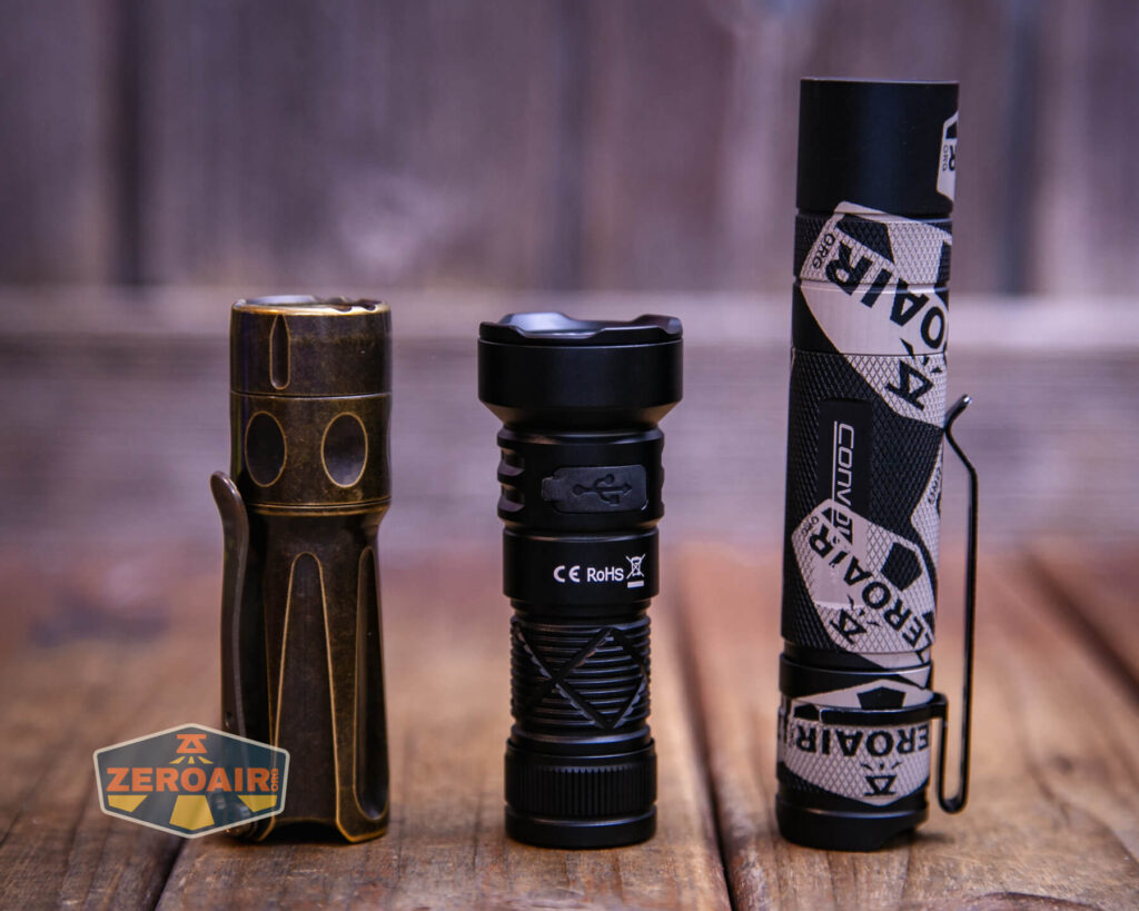 Sofirn SR20 Mini EDC flashlight with two standard sized flashlights