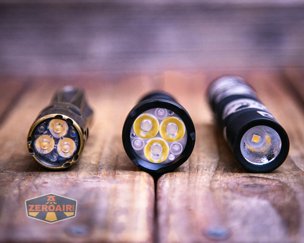 Sofirn SR20 Mini EDC flashlight with two standard sized flashlights