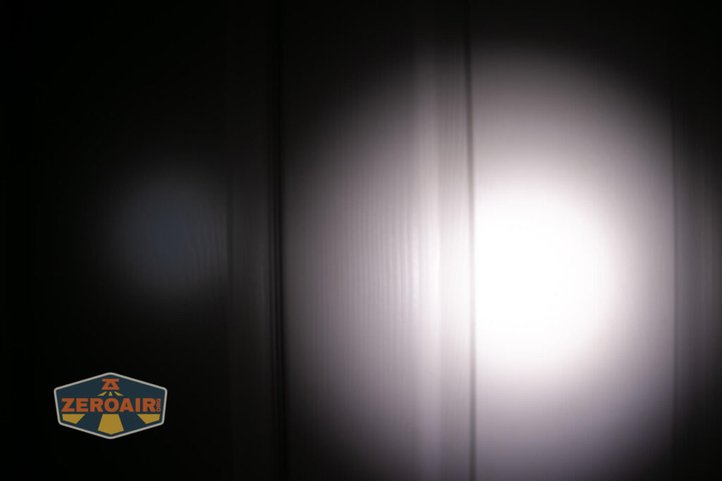 Sofirn SR20 Mini EDC flashlight beamshots on door (at 1') compared to nichia 219b 4500K