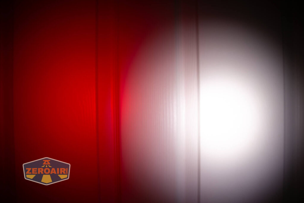 Sofirn SR20 Mini EDC flashlight beamshots on door (at 1') compared to nichia 219b 4500K