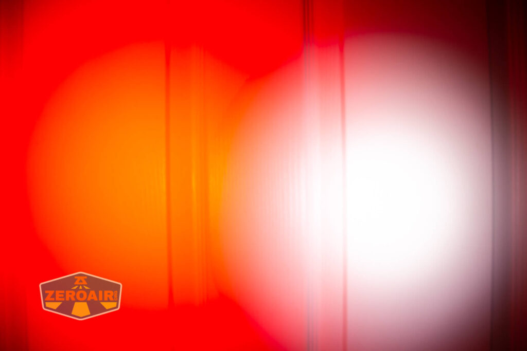 Sofirn SR20 Mini EDC flashlight beamshots on door (at 1') compared to nichia 219b 4500K