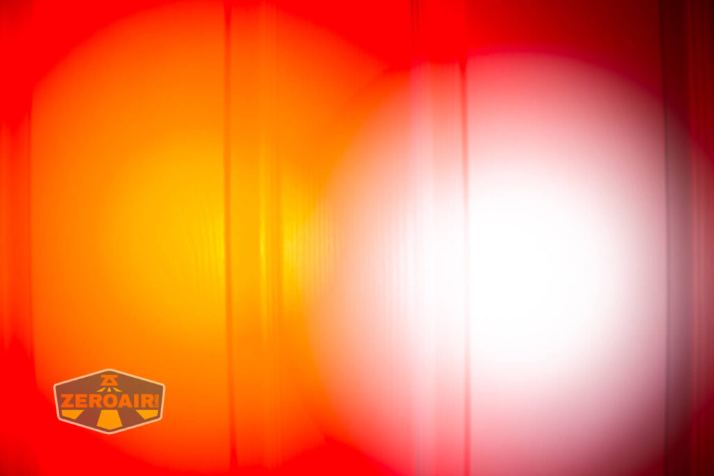 Sofirn SR20 Mini EDC flashlight beamshots on door (at 1') compared to nichia 219b 4500K