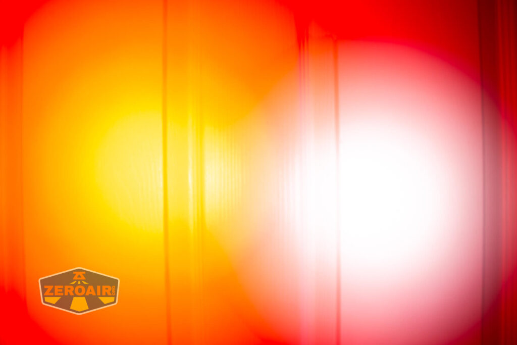 Sofirn SR20 Mini EDC flashlight beamshots on door (at 1') compared to nichia 219b 4500K