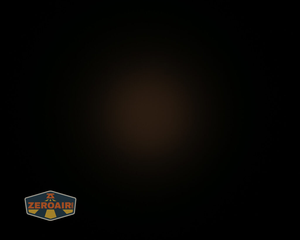 A mostly black image with a faint brownish circle in the center; the ZeroAir logo appears in the bottom left corner.