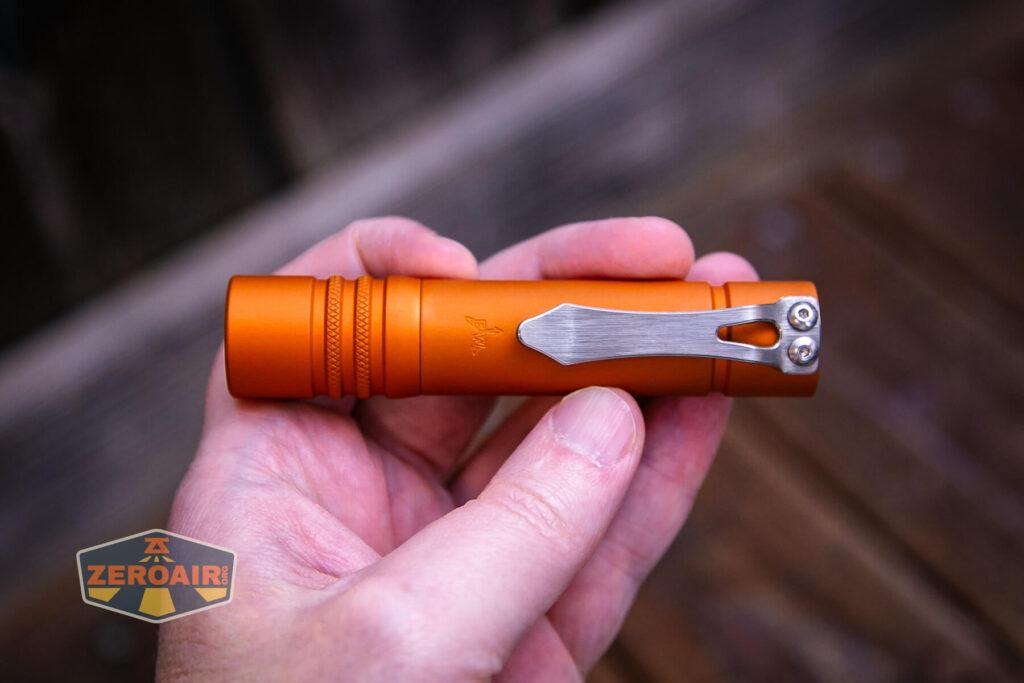 Focusworks EDC F3 Pumpkin Orange flashlight in hand