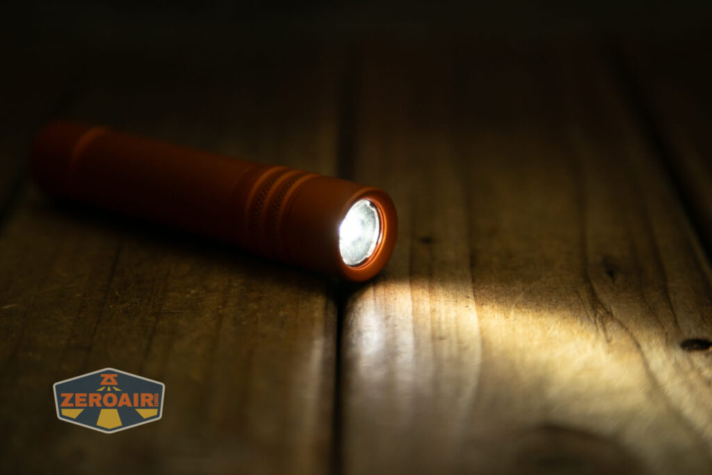 Focusworks EDC F3 Pumpkin Orange flashlight emitter on