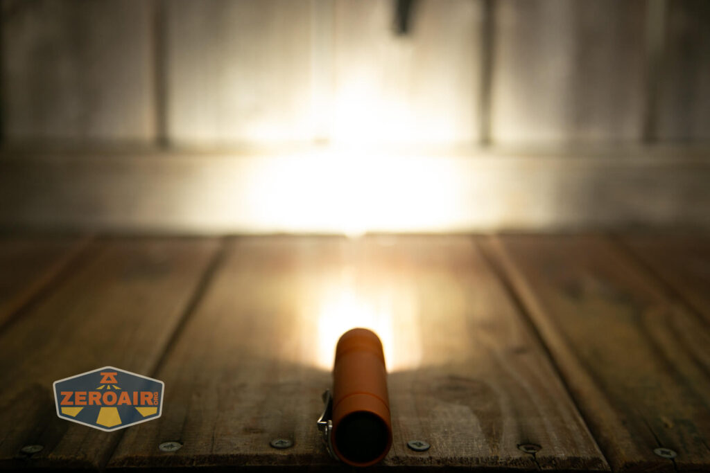 Focusworks EDC F3 Pumpkin Orange flashlight emitter on