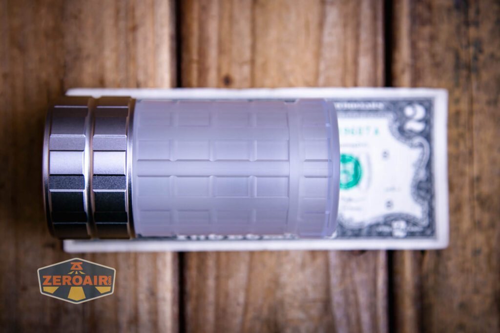 Lumintop Aurora flashlight powerbank on a two dollar bill