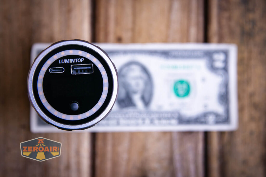Lumintop Aurora flashlight powerbank on a two dollar bill