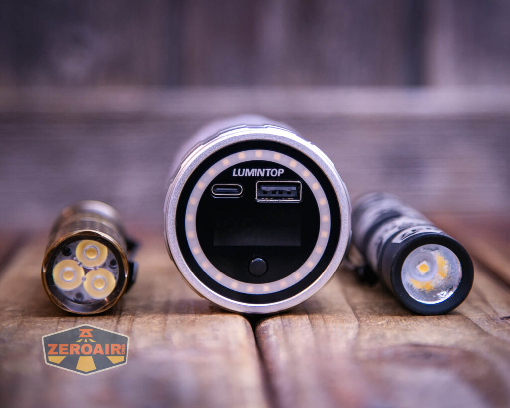 Lumintop Aurora flashlight powerbank on a two dollar bill