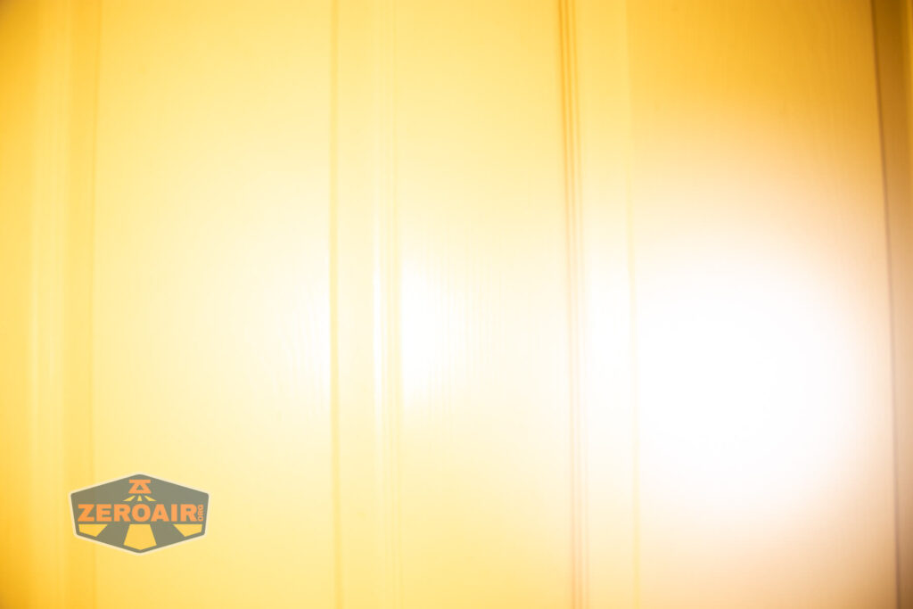 Lumintop Aurora flashlight powerbank beamshots on door (at 1') compared to nichia 219b 4500K