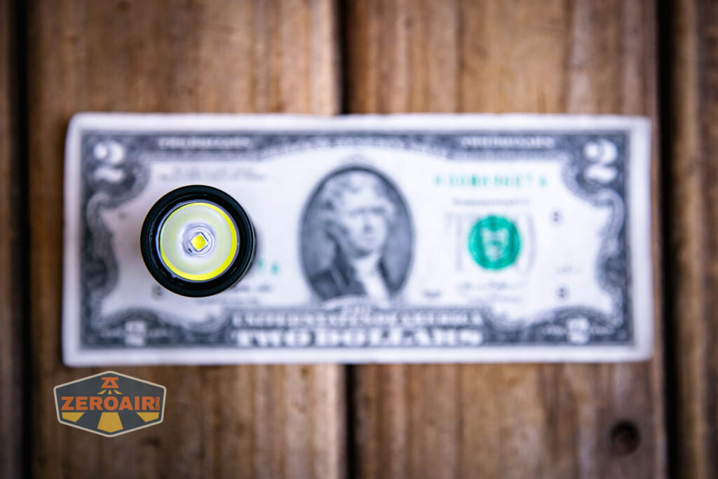 Lumintop GT Nano V5.0 flashlight on a two dollar bill