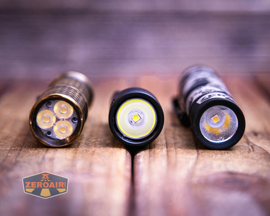 Lumintop GT Nano V5.0 flashlight with two standard sized flashlights