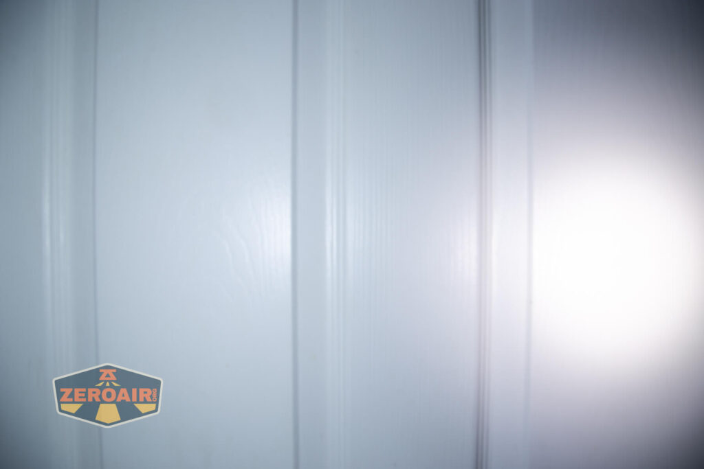 Lumintop W1 flashlight beamshots on door compared to nichia 219b