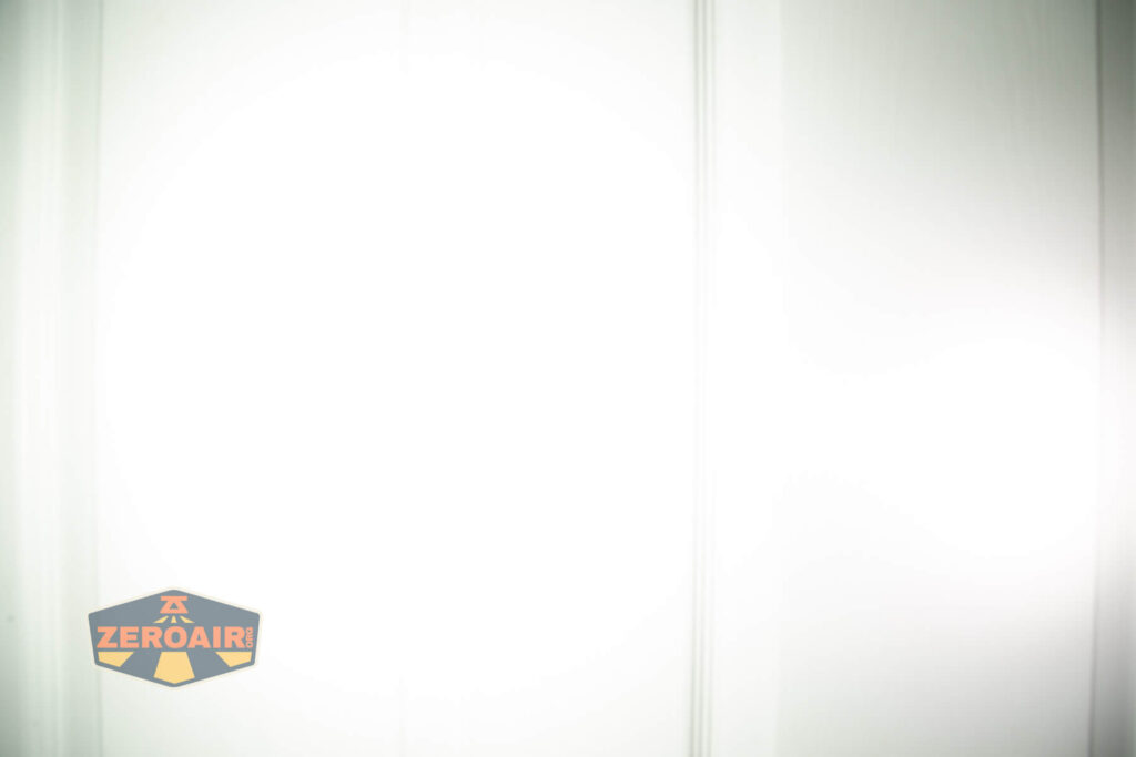 Maratac X-3 Gen II flashlight beamshots on door (at 1') compared to nichia 219b 4500K