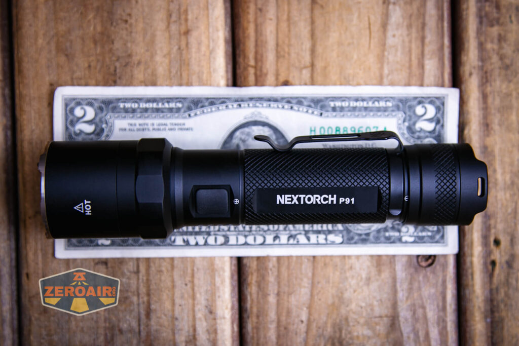 Nextorch P91 flashlight on a two dollar bill