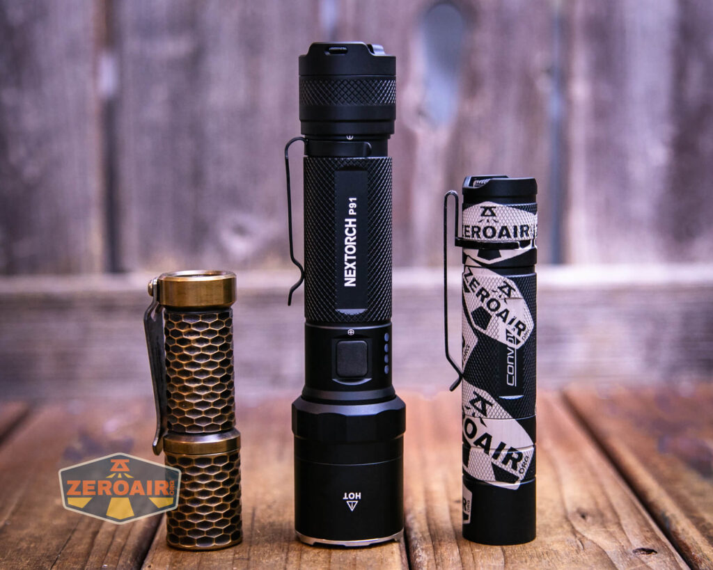 Nextorch P91 flashlight with two standard sized flashlights