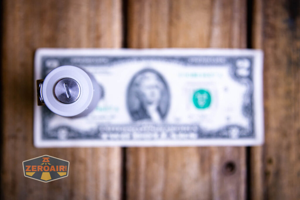 NLightD L3 LEP flashlight on two dollar bill