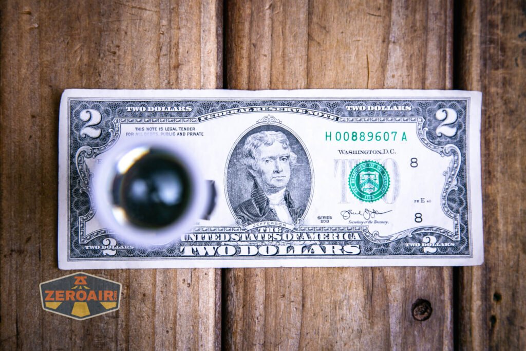 NLightD L3 LEP flashlight on two dollar bill
