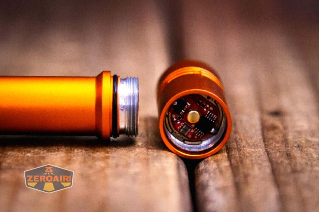 ReyLight Pineapple Mini Mk II flashlight head off showing contacts and threads