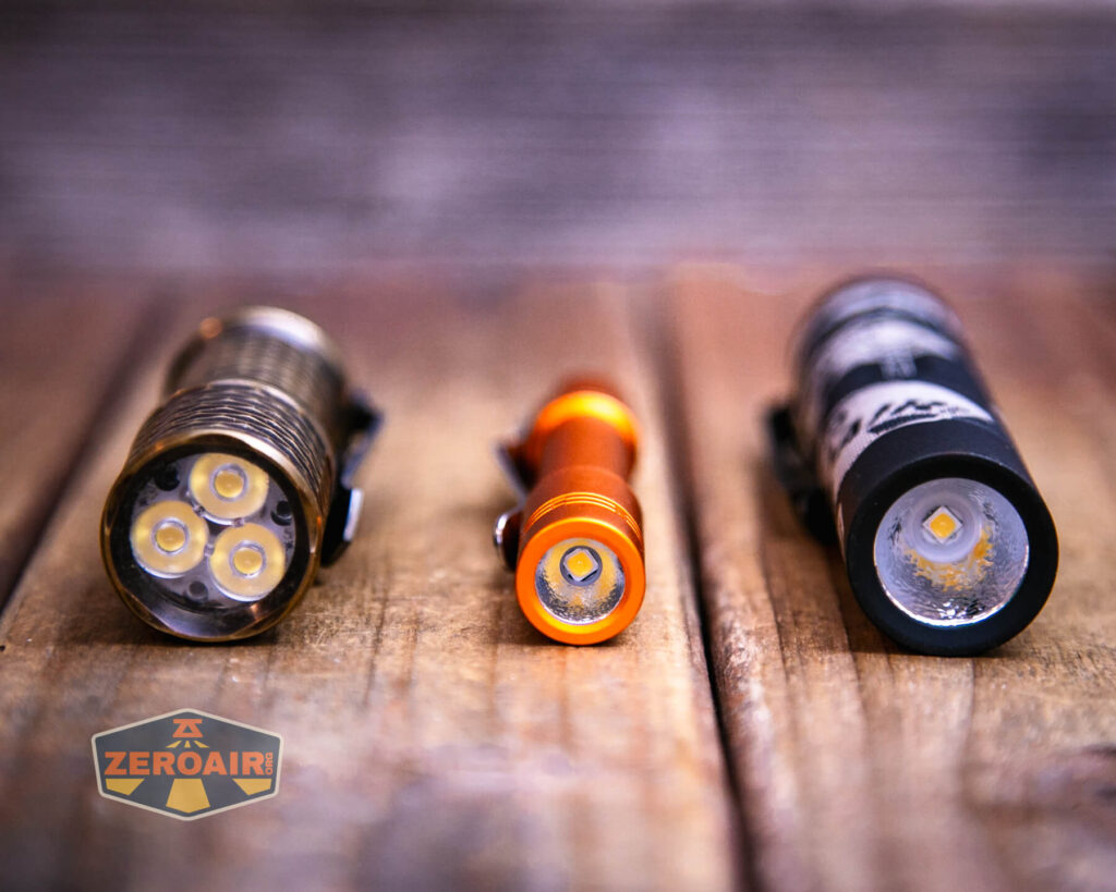 ReyLight Pineapple Mini Mk II flashlight with two standard sized flashlights