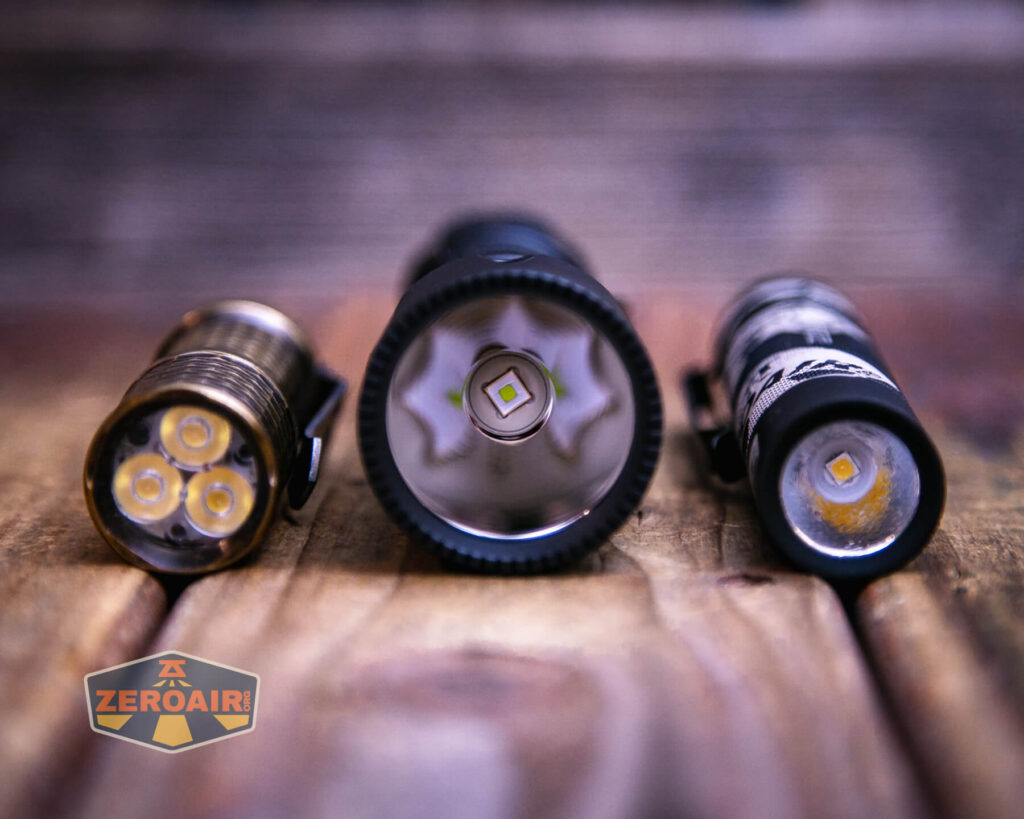 Weltool T12 Plus Nine Dragons flashlight with two standard sized flashlights