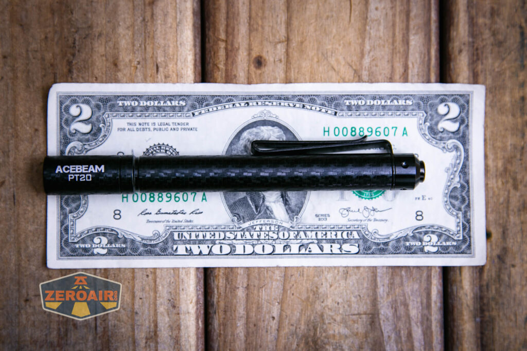 Acebeam PT20 portable EDC penlight on a two dollar bill