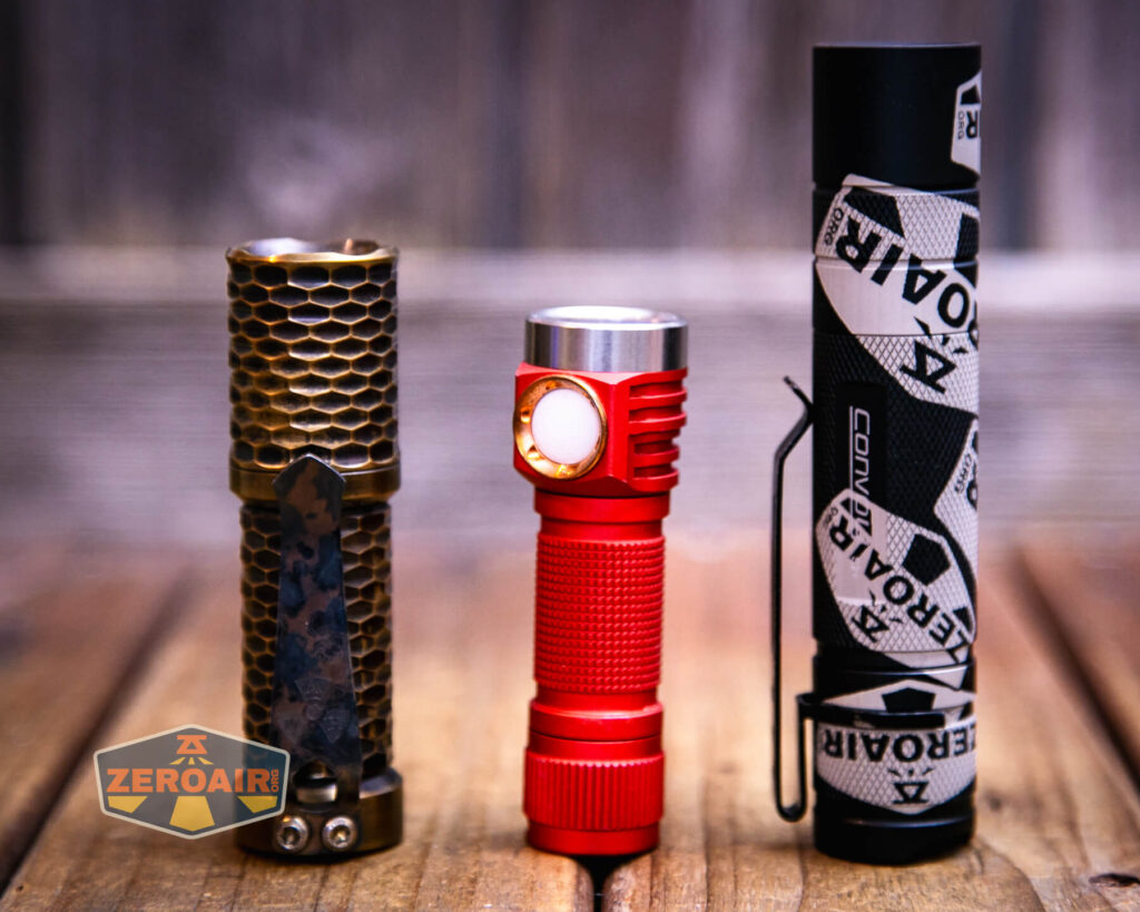 Emisar D3AA 5700K flashlight with two standard sized flashlights